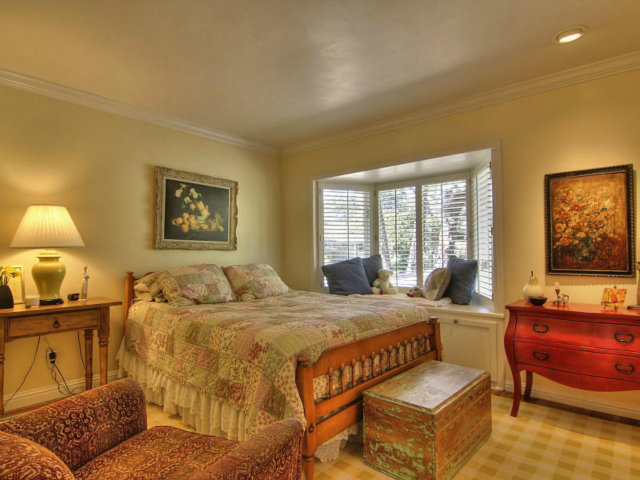 25064 Hatton Road Carmel, CA 93923 - Photo 14 of 25 a bedroom with a bed and wooden floor