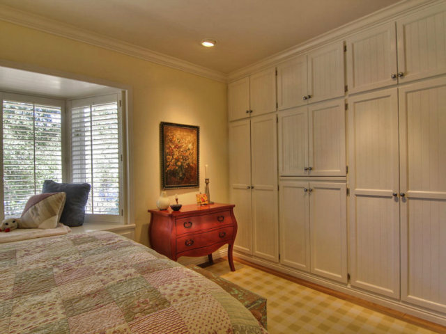 25064 Hatton Road Carmel, CA 93923 - Photo 15 of 25 a bedroom with a bed and wooden floor