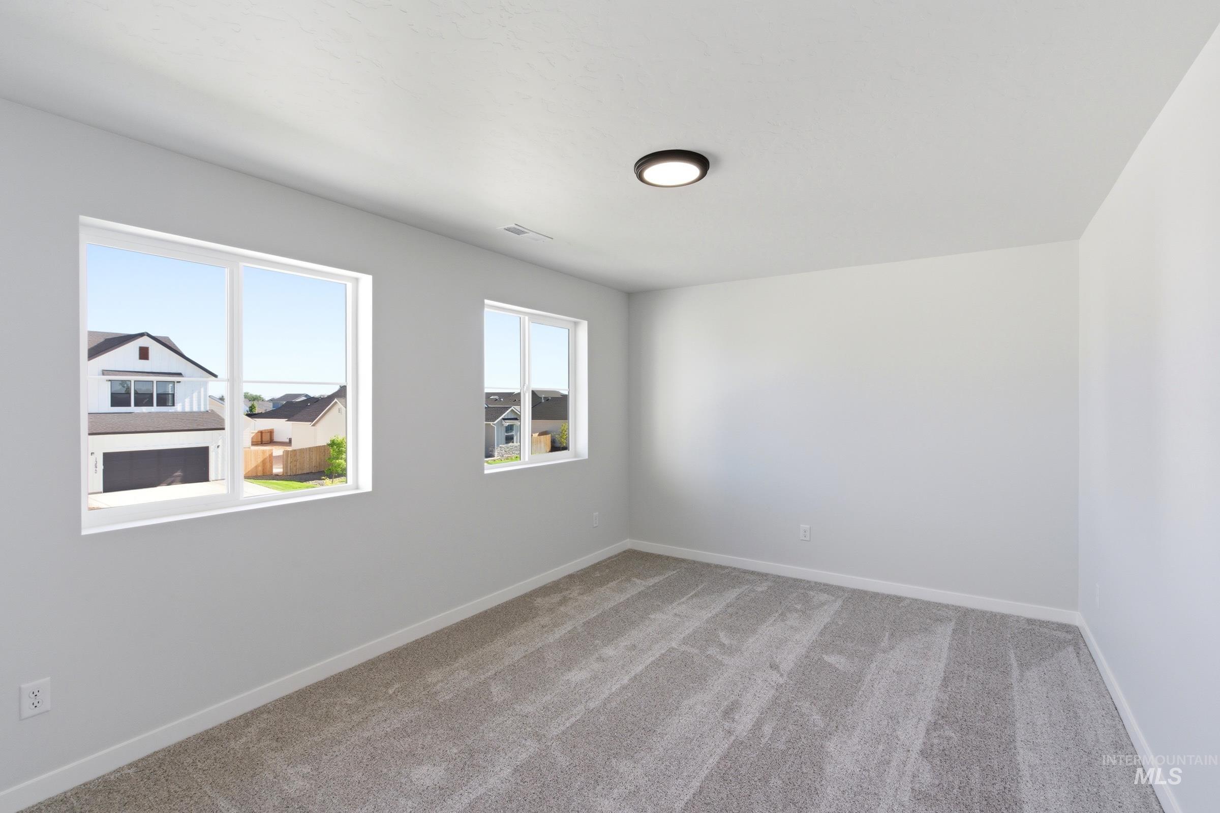 13677 Redway Court Caldwell, ID 83607 - Photo 25 of 35 Neutral wall tones with textured gray carpeting