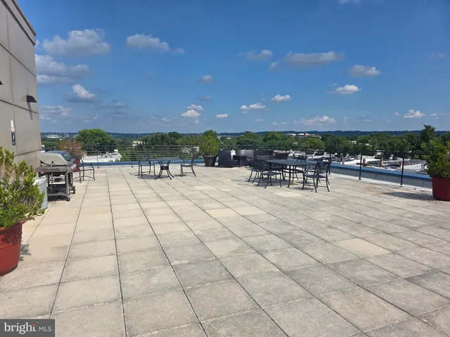 a view of a terrace with furniture