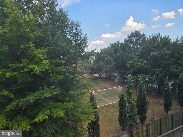 a view of a dinning table and chairs in the balcony