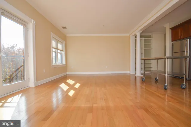a view of an empty room with a window