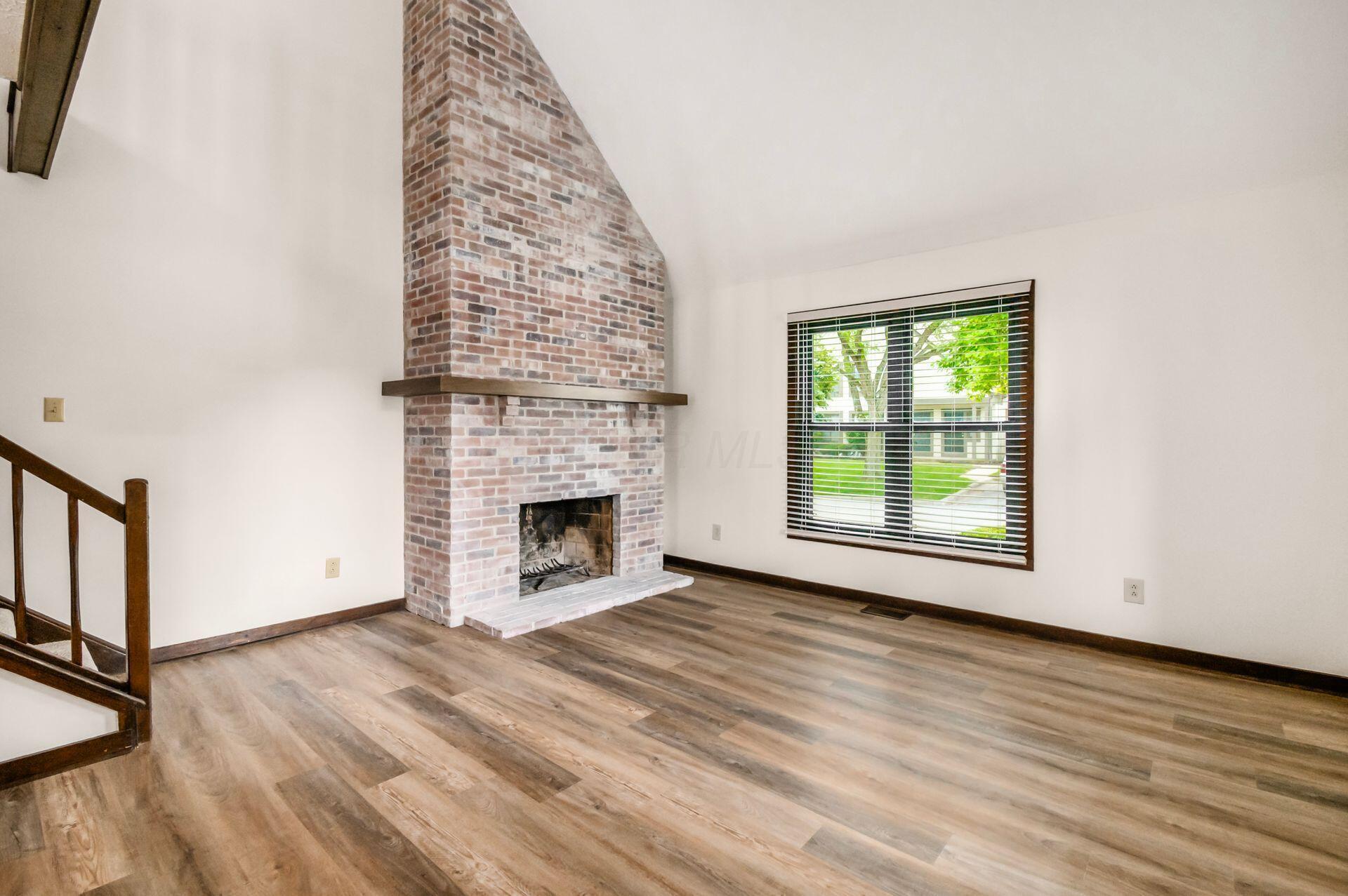 432 Edinburgh Road Dublin, OH 43017 - Photo 3 of 20 Whitewashed woodburning fireplace