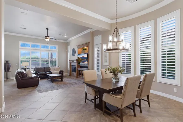 a dining room with furniture and window