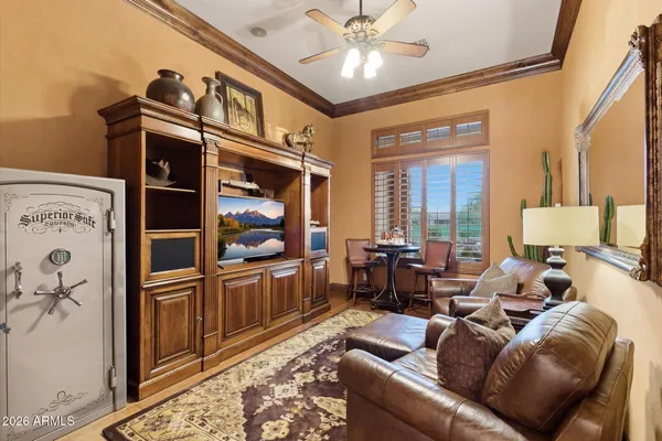 a living room with furniture a large window and a flat screen tv