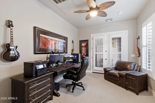 a large spacious bathroom with a tub sink shower and mirror