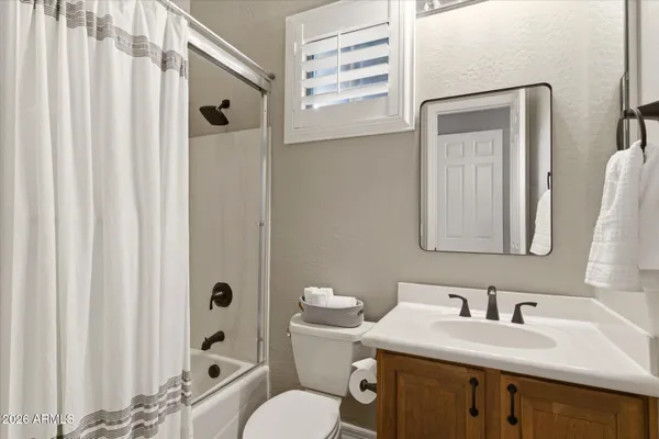 a view of a patio with a table and chairs