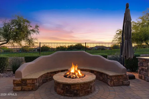 a view of a house with backyard porch and sitting area