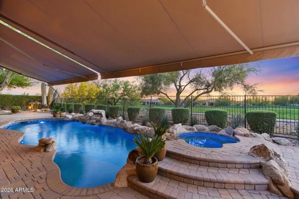 a view of a livingroom with furniture window and wooden floor