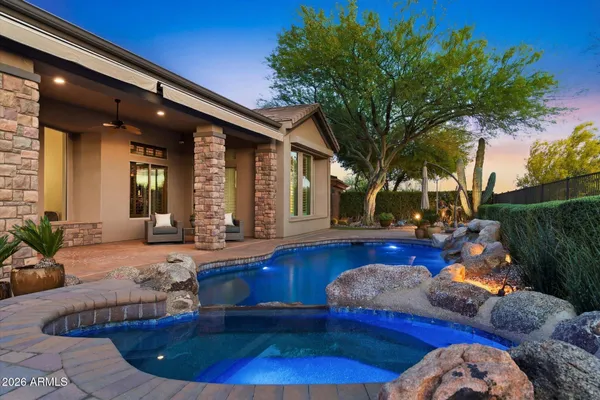 an aerial view of residential houses with outdoor space and river