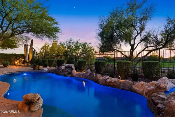 an aerial view of residential houses with outdoor space and river