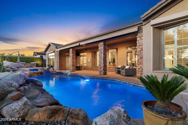 a view of a backyard with sitting area