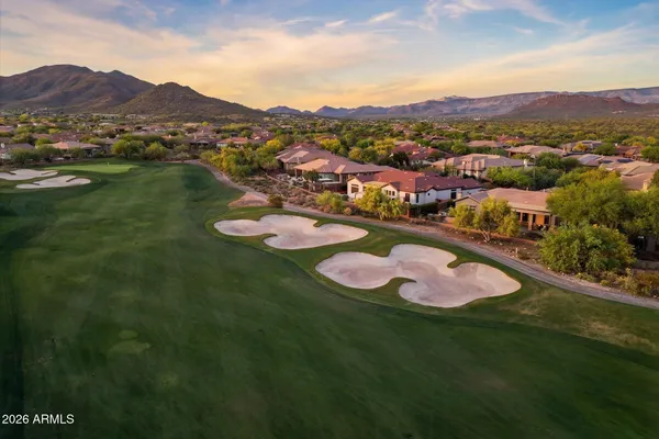 an aerial view of ocean residential house with outdoor space and mountain view in back