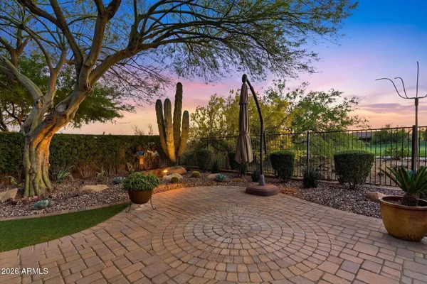 an aerial view of a house with a lake view