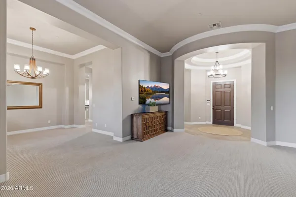 a view of a hallway with a chandelier
