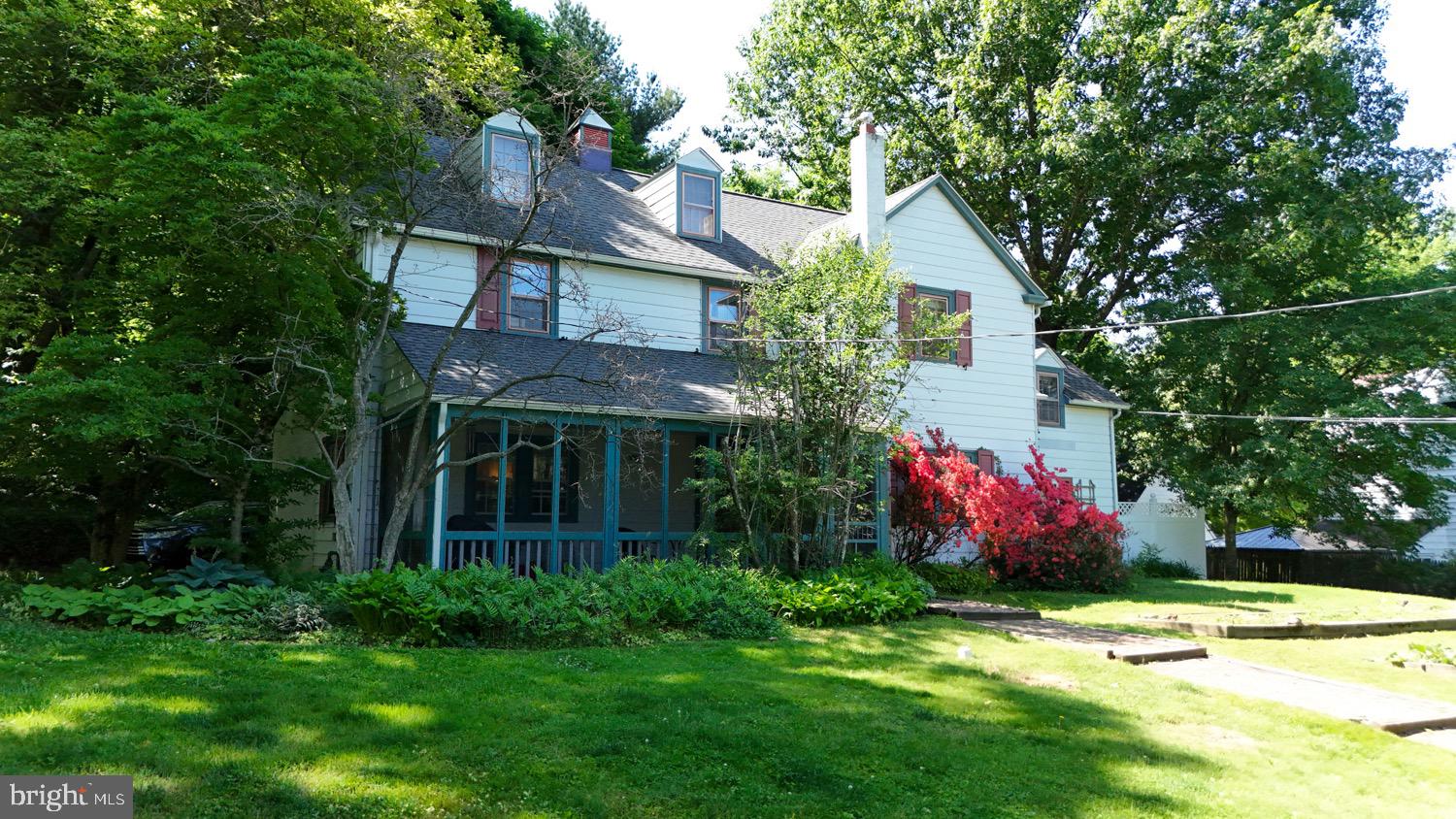 2701 Alden Road Bryn Athyn, PA 19006 - Photo 2 of 105 a view of a house with a yard and garden