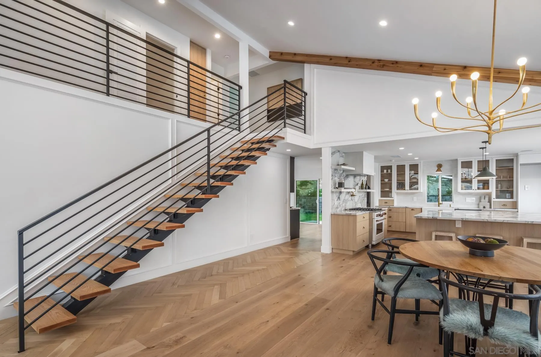 2125 Woodwind Drive Encinitas, CA 92024 - Photo 15 of 33 a dining room with furniture and wooden floor