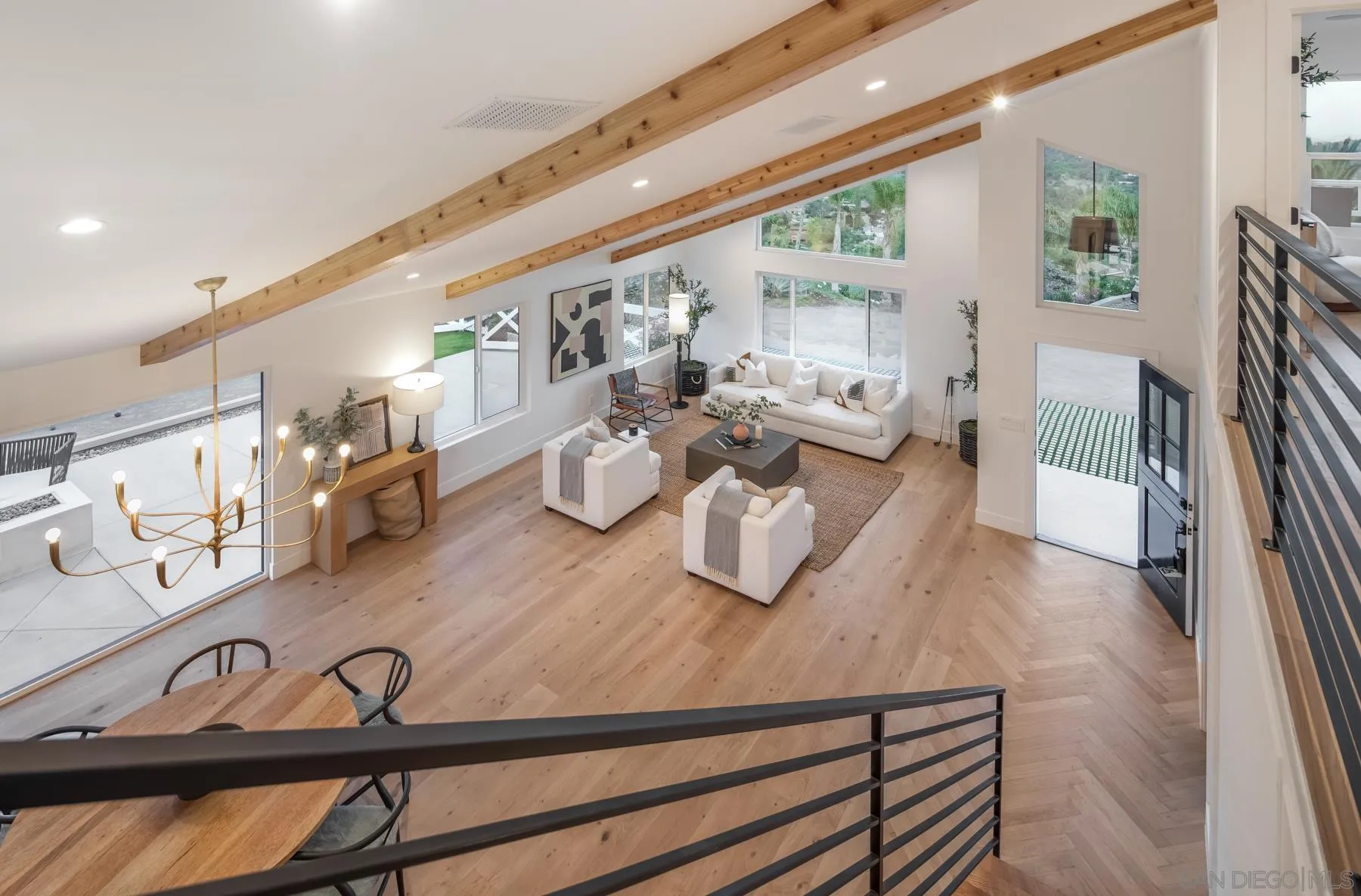 2125 Woodwind Drive Encinitas, CA 92024 - Photo 16 of 33 a living room with furniture and wooden floor