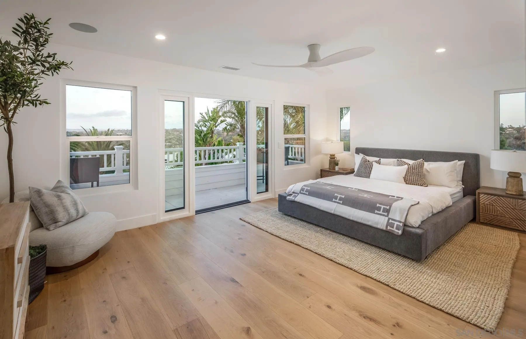 2125 Woodwind Drive Encinitas, CA 92024 - Photo 17 of 33 a bedroom with a large bed and a large window