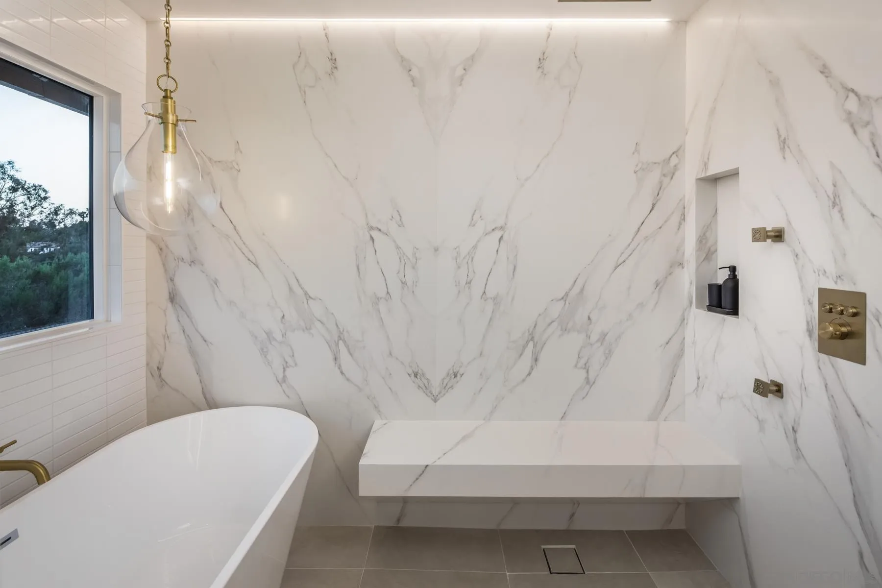 2125 Woodwind Drive Encinitas, CA 92024 - Photo 19 of 33 a bathroom with a white tub and shower