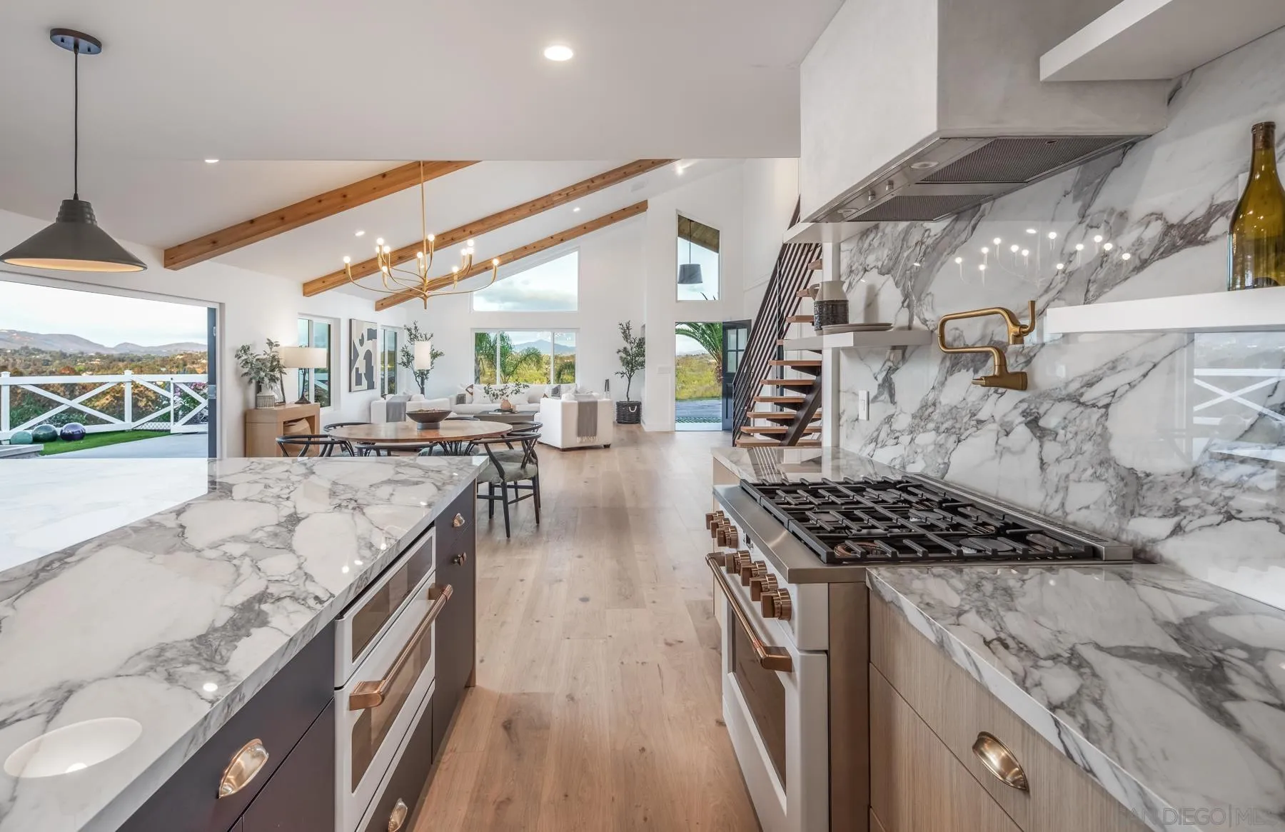 2125 Woodwind Drive Encinitas, CA 92024 - Photo 5 of 33 a kitchen with granite countertop a stove and a sink