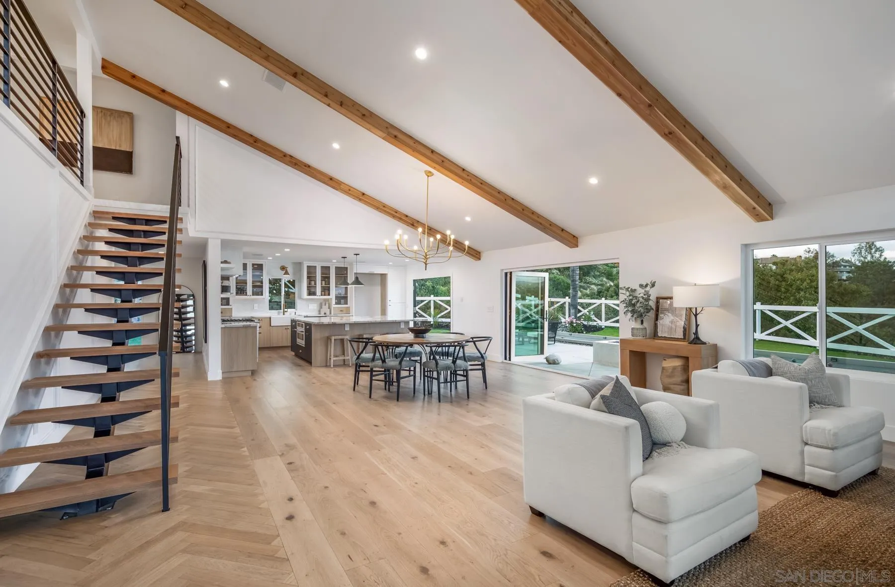 2125 Woodwind Drive Encinitas, CA 92024 - Photo 7 of 33 a living room with furniture and entryway with wooden floor