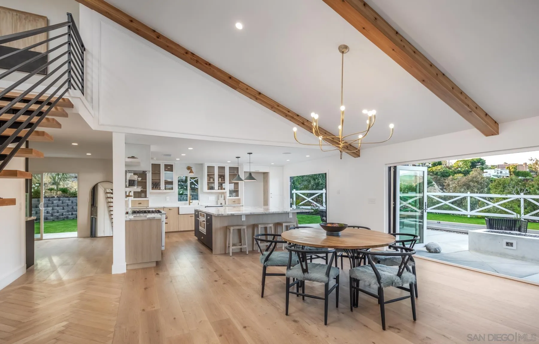 2125 Woodwind Drive Encinitas, CA 92024 - Photo 8 of 33 a view of a dining room with furniture window and wooden floor