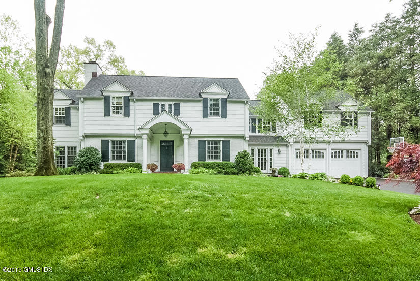 11 Owenoke Way Riverside, CT 06878 - Photo 1 of 61 a front view of a house with a garden