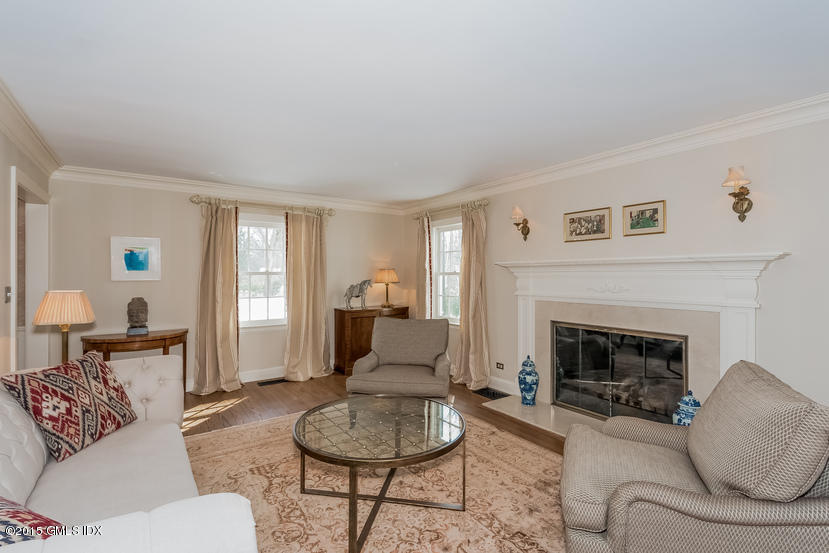 11 Owenoke Way Riverside, CT 06878 - Photo 15 of 61 a living room with furniture and a fireplace