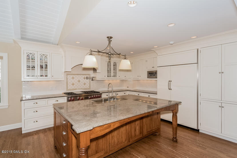 11 Owenoke Way Riverside, CT 06878 - Photo 25 of 61 a kitchen with stainless steel appliances granite countertop a sink a stove and a refrigerator