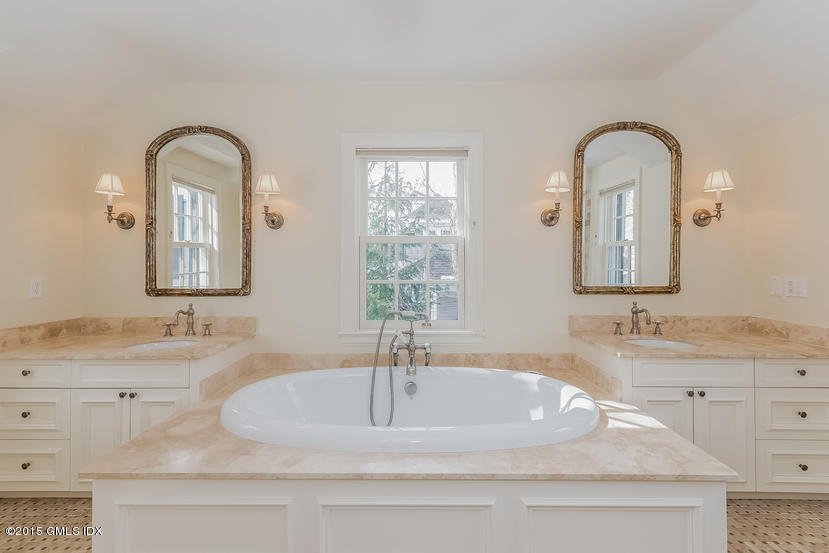 11 Owenoke Way Riverside, CT 06878 - Photo 39 of 61 a bathroom with a double vanity sink and mirror