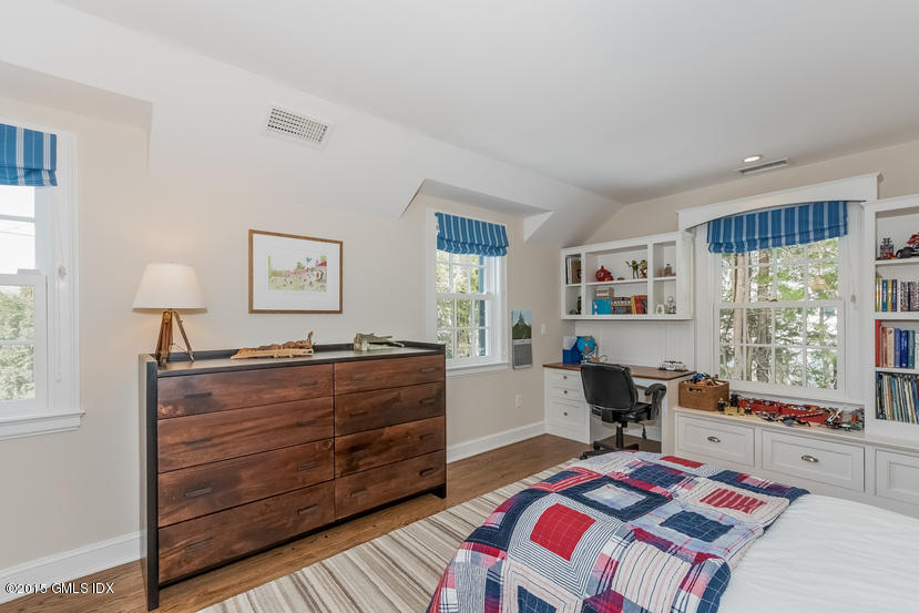11 Owenoke Way Riverside, CT 06878 - Photo 45 of 61 a bed room with a bed window and a chair