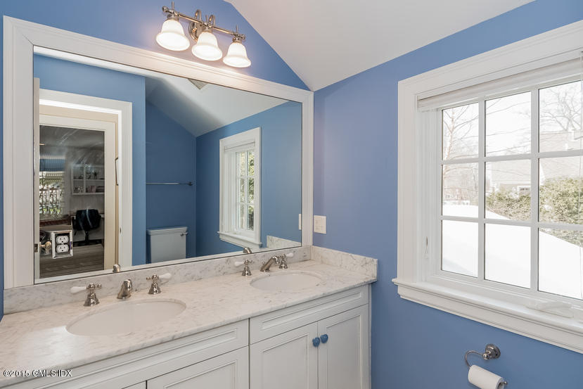 11 Owenoke Way Riverside, CT 06878 - Photo 46 of 61 a bathroom with a sink and a mirror