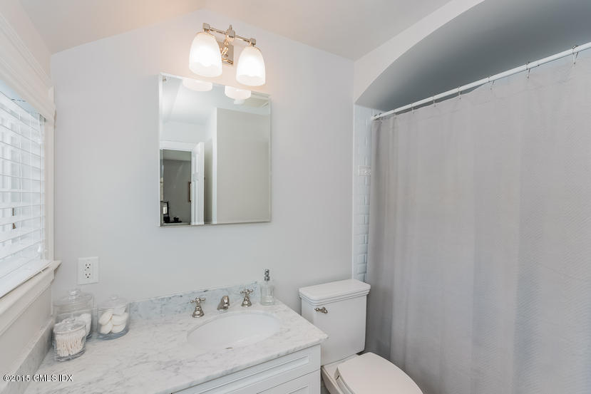 11 Owenoke Way Riverside, CT 06878 - Photo 51 of 61 a bathroom with a sink vanity mirror and toilet