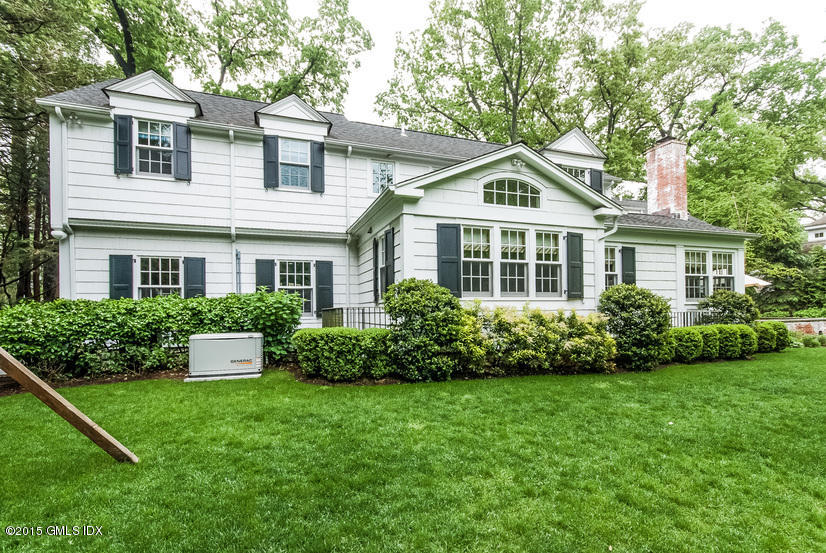 11 Owenoke Way Riverside, CT 06878 - Photo 6 of 61 a front view of a house with a yard