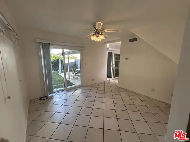a bathroom with a shower and a glass door