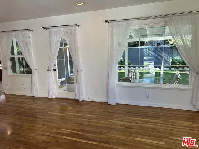 a view of wooden floor and brick walls