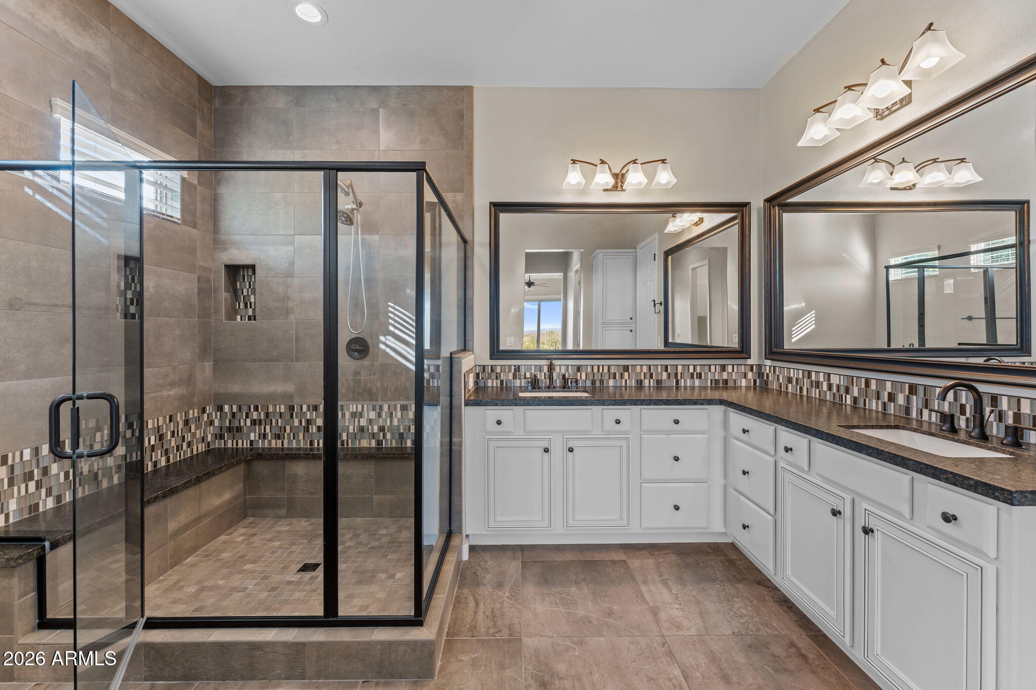 3675 Gold Ridge Road Wickenburg, AZ 85390 - Photo 22 of 58 a bathroom with a shower a sink and a mirror