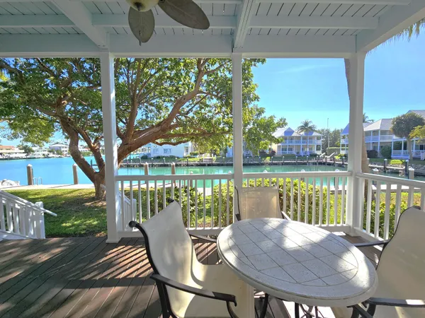 a view of balcony with wooden floor and outdoor seating