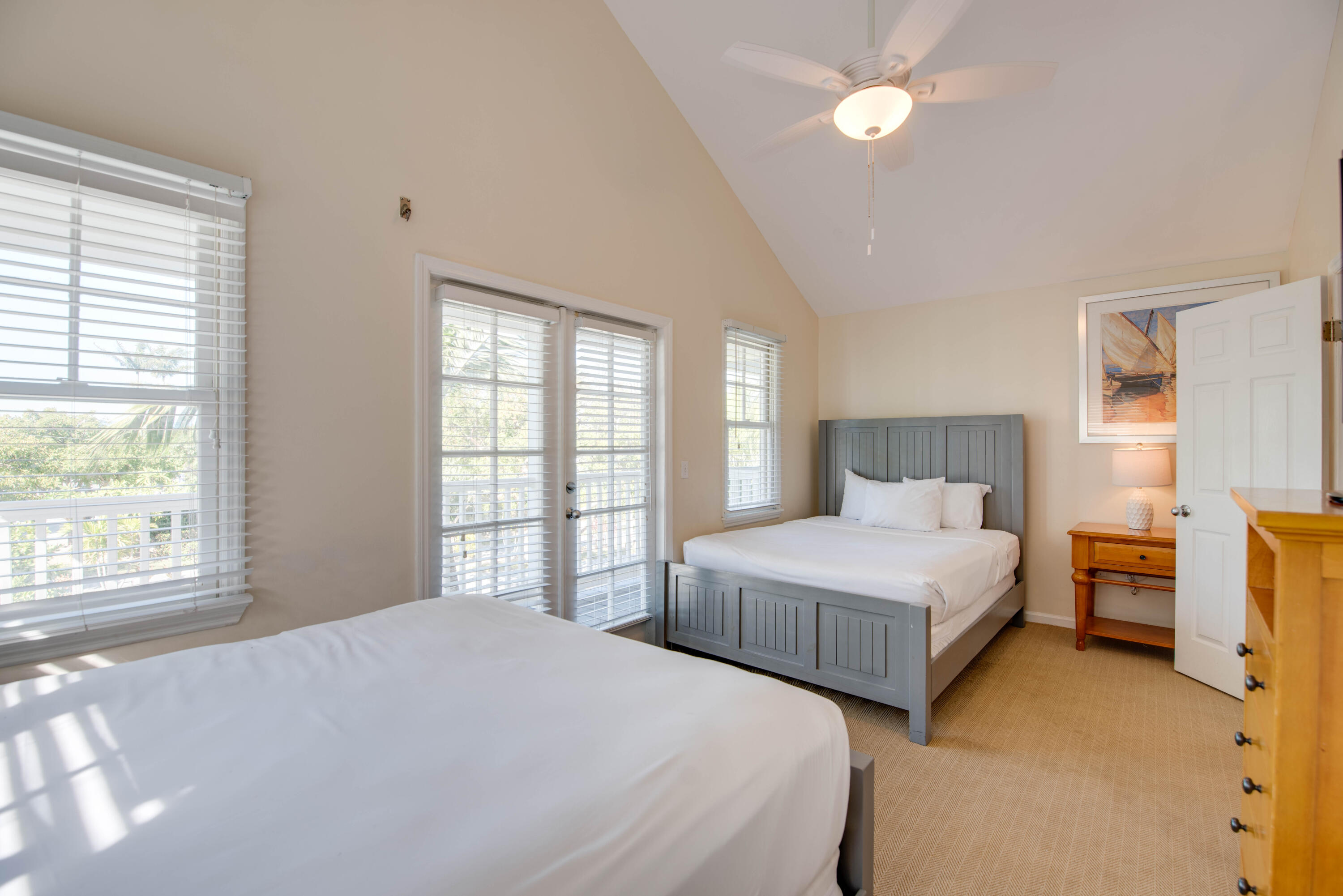 7073 Hawks Cay Boulevard Marathon, FL 33050 - Photo 27 of 50 a bedroom with double bed and a window