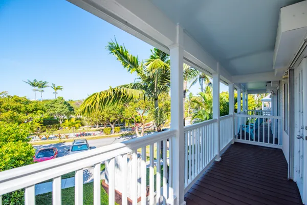 a view of balcony with wooden floor