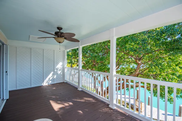 a view of a porch with wooden floor and outdoor space