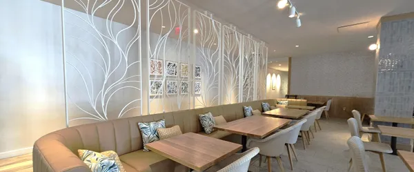 a living room with furniture and a gate