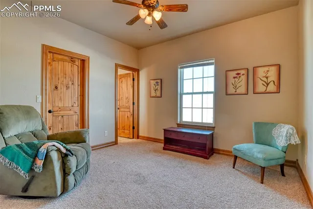 a bedroom with furniture and a window