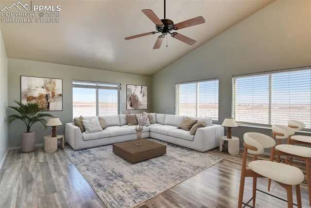 a living room with furniture and a large window