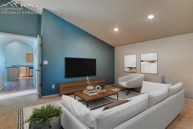 a living room with furniture and a flat screen tv