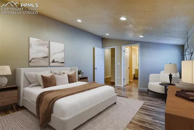 a bedroom with double bed and a couch