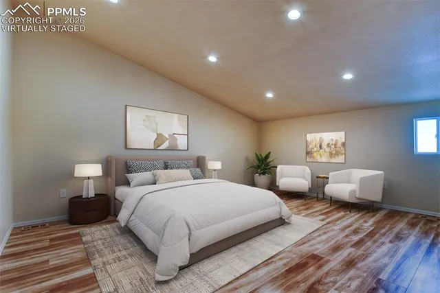 a bedroom with bed and a night stand