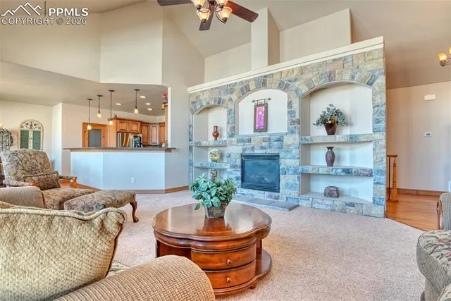 a living room with furniture and a fireplace