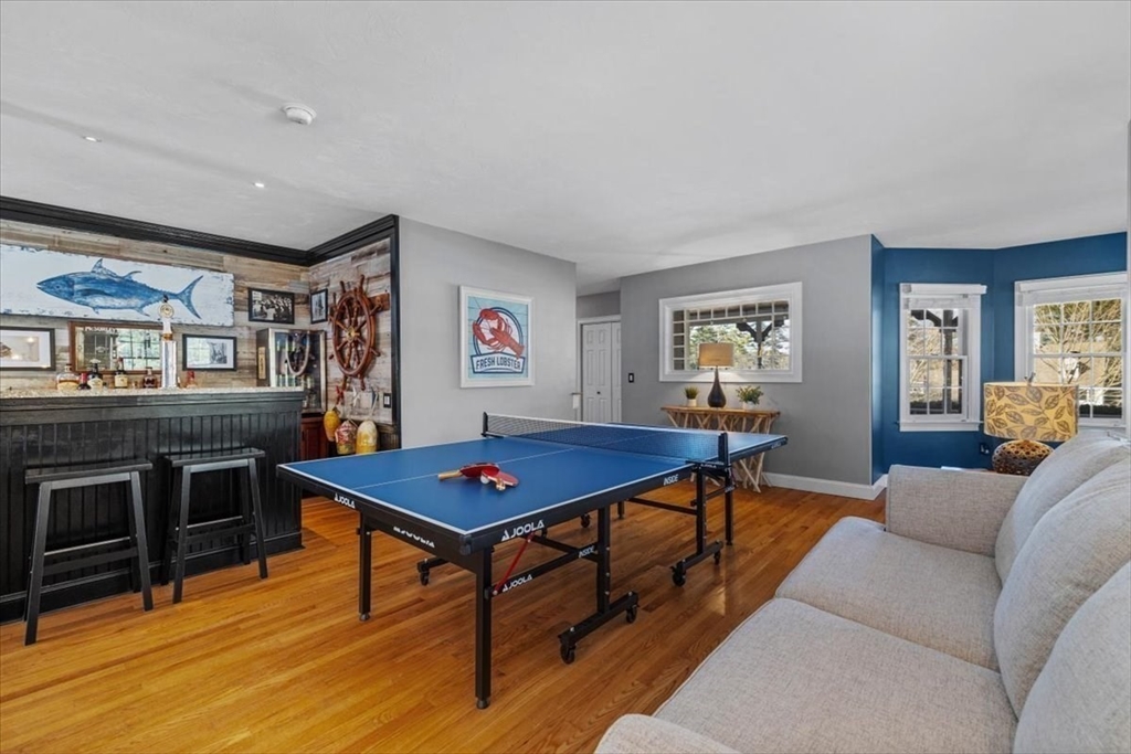 31 Round Hill Road Kingston, MA 02364 - Photo 20 of 42 a living room with furniture a flat screen tv and a table